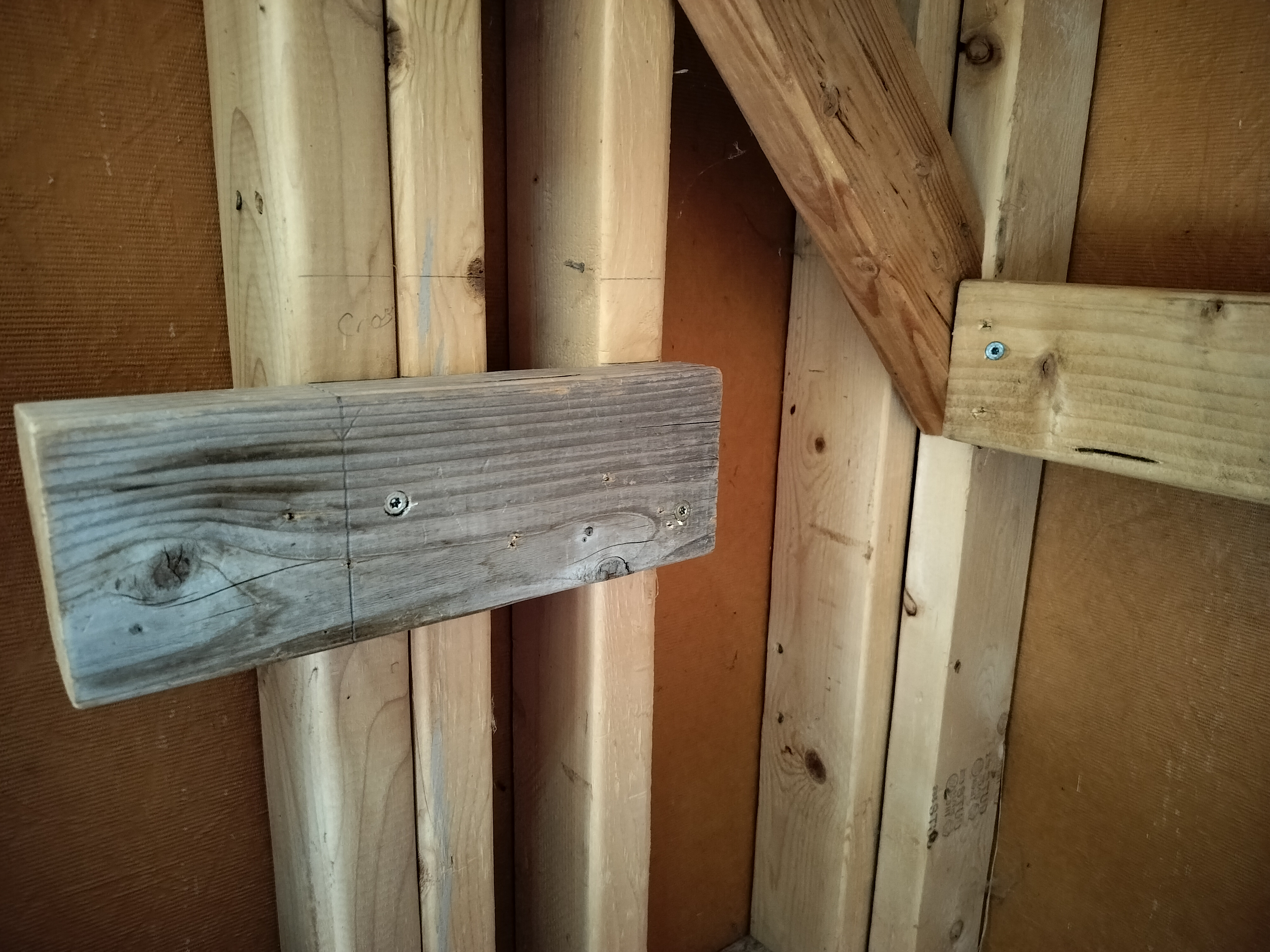 First end support attached to wall studs, spaced 1.5 inches for front support