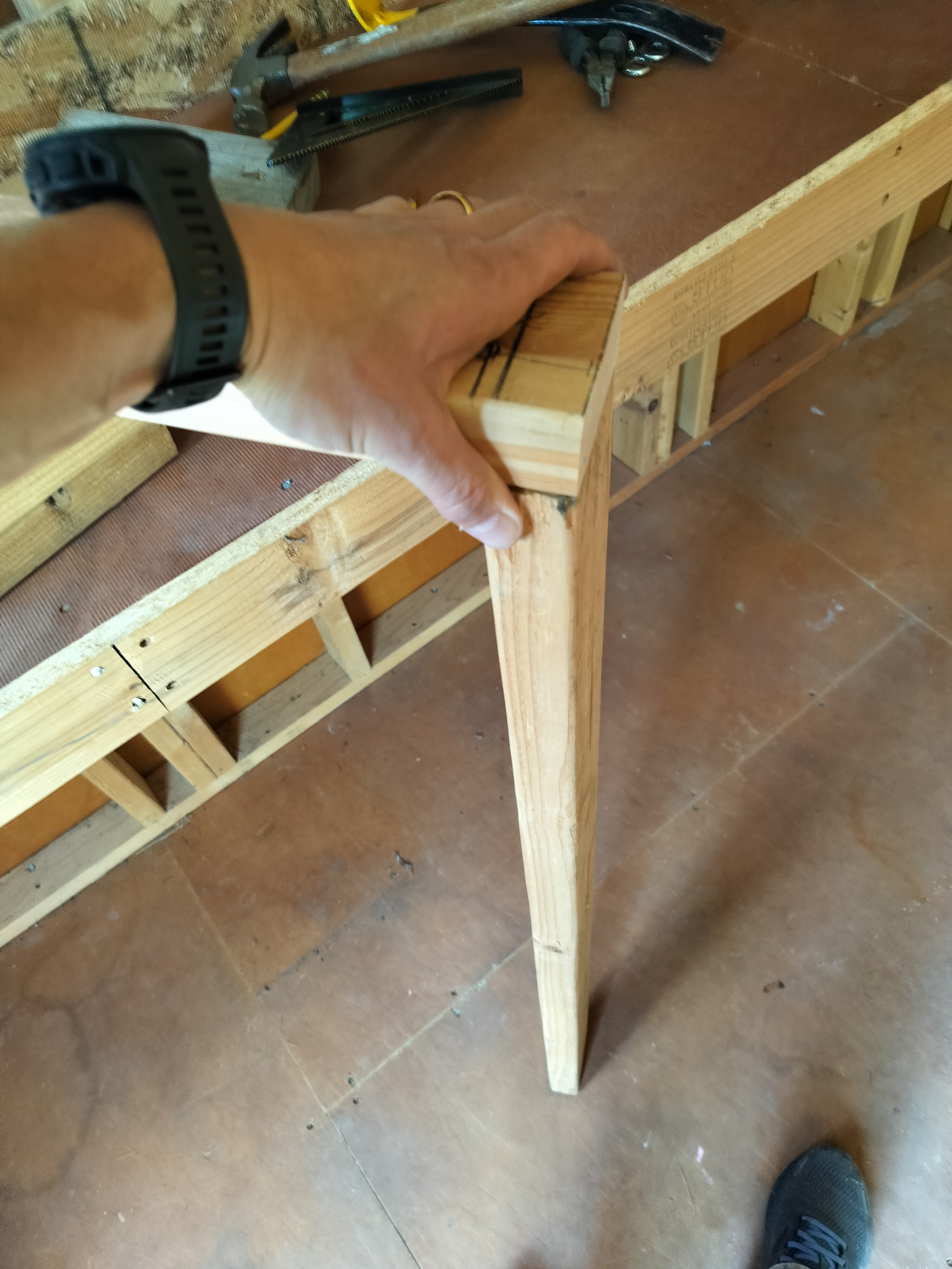 About to screw the leg to the first front support beam