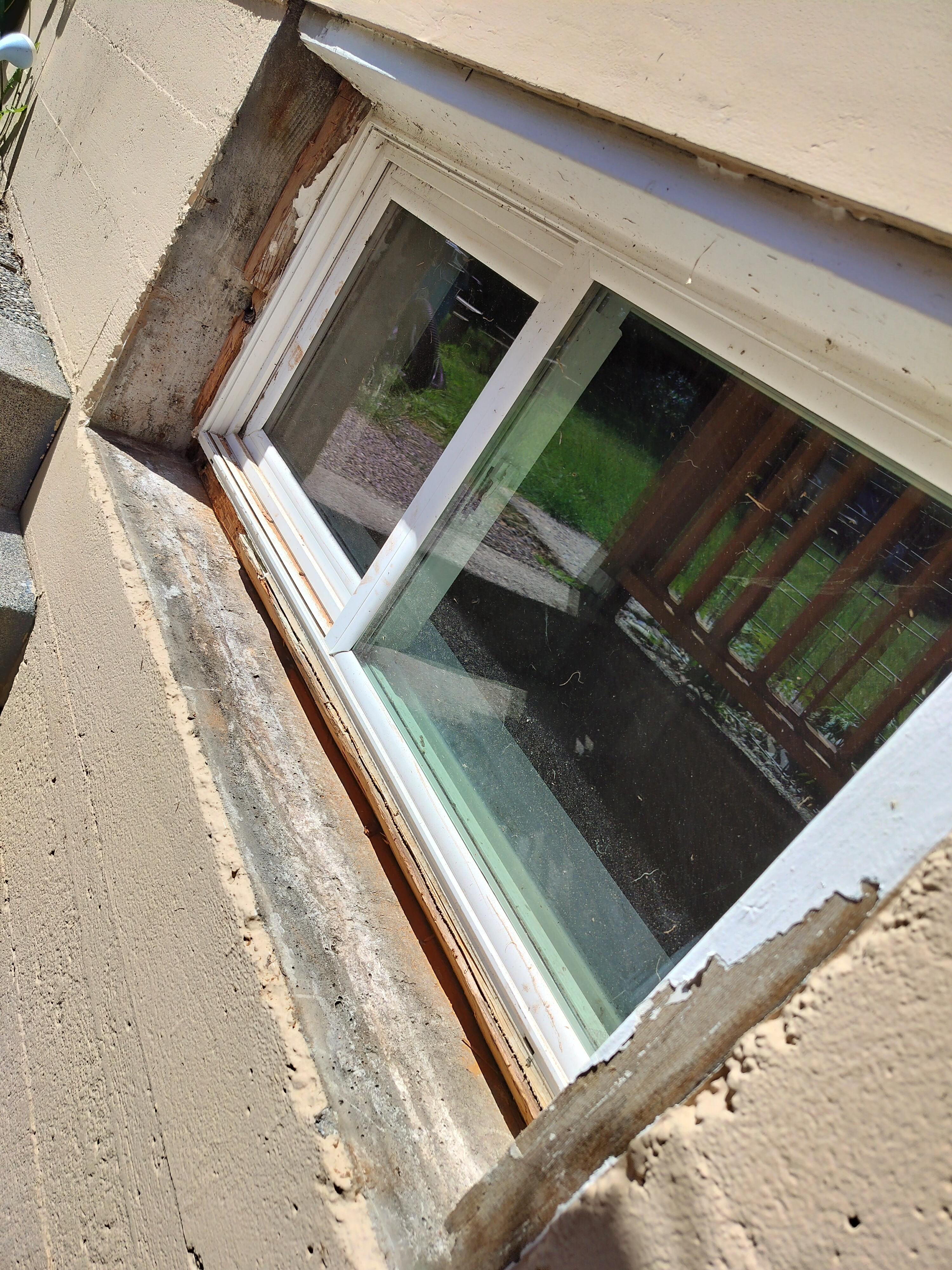 Close-up of rot and damage in window frame